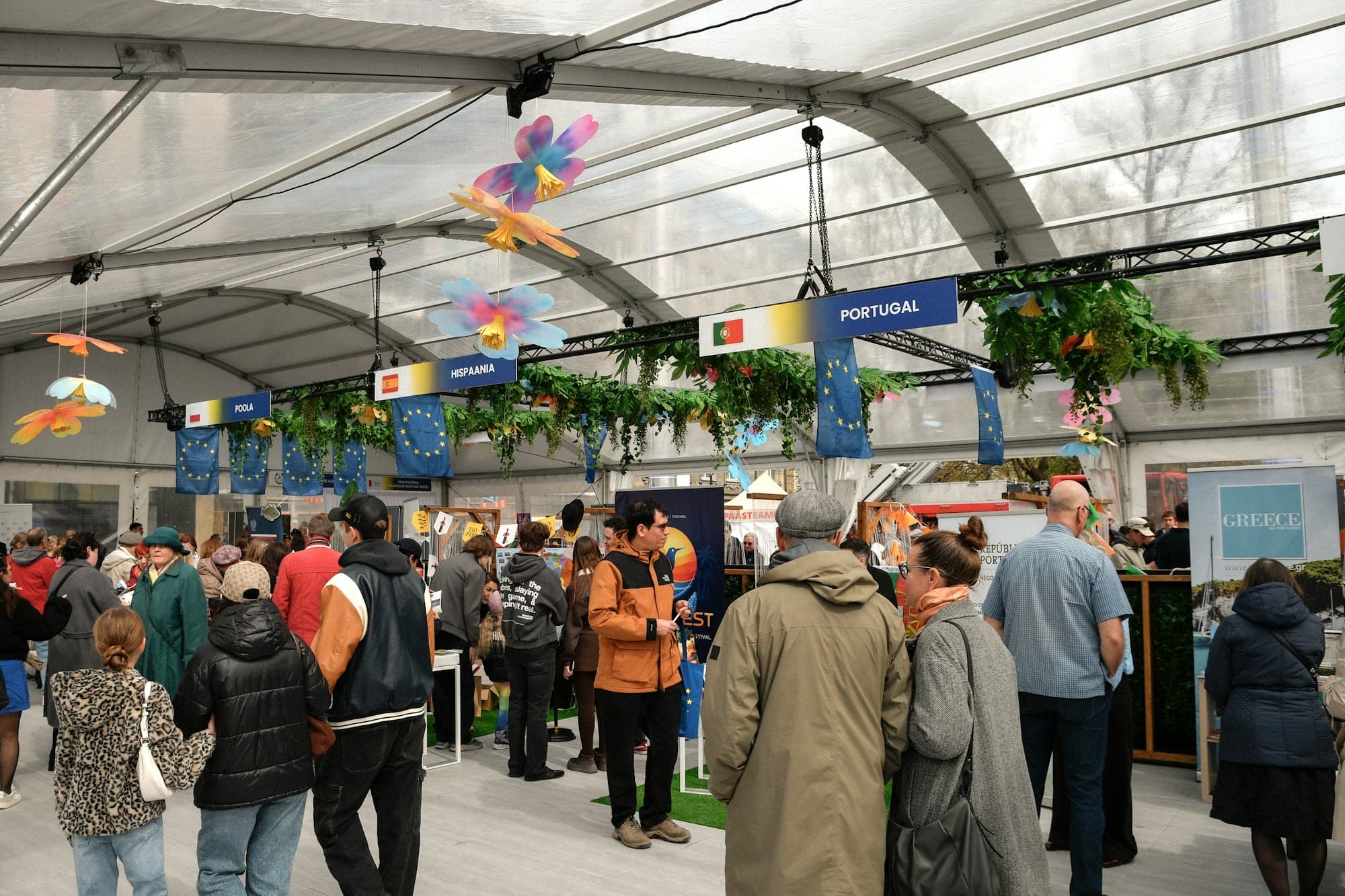 Visitors explore country pavilions inside a large exhibition hall