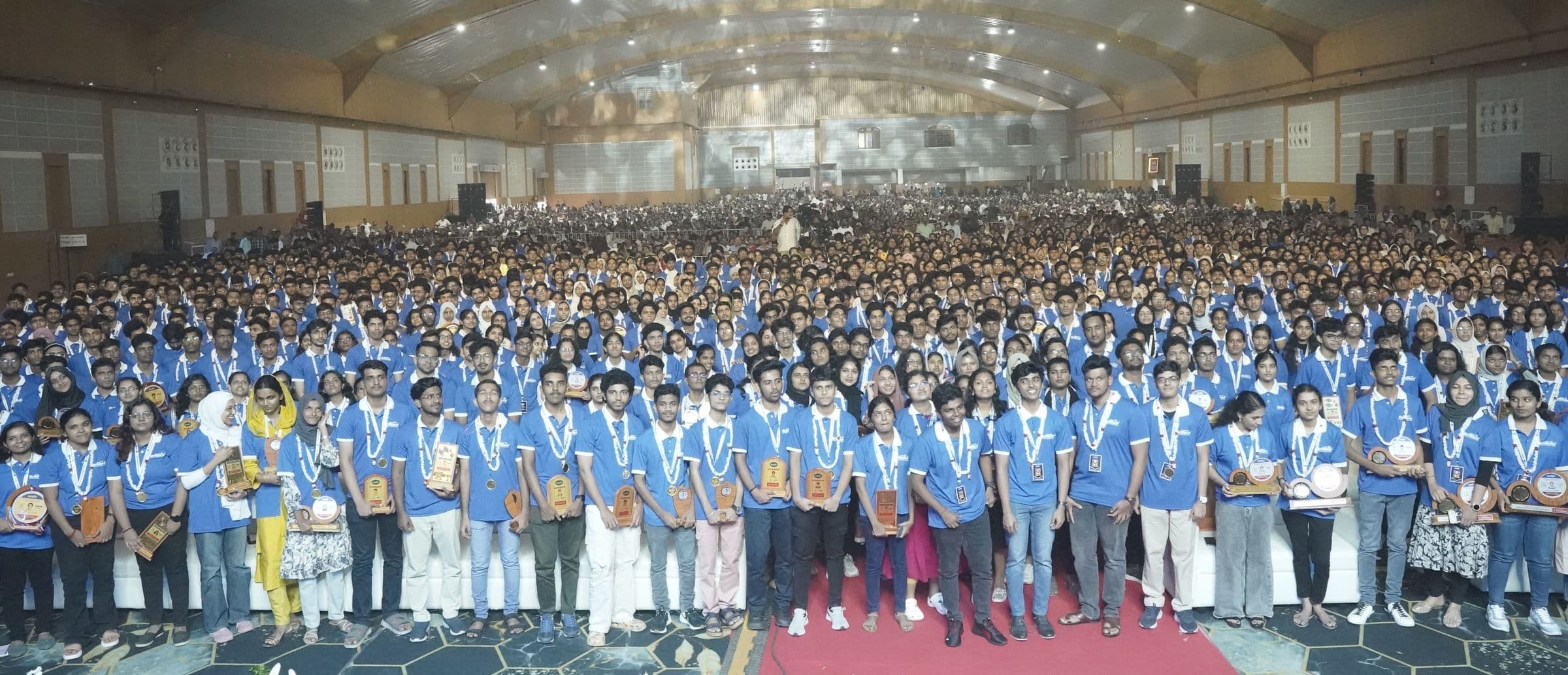 A wide view of a hall filled with students at Medical Victory Day