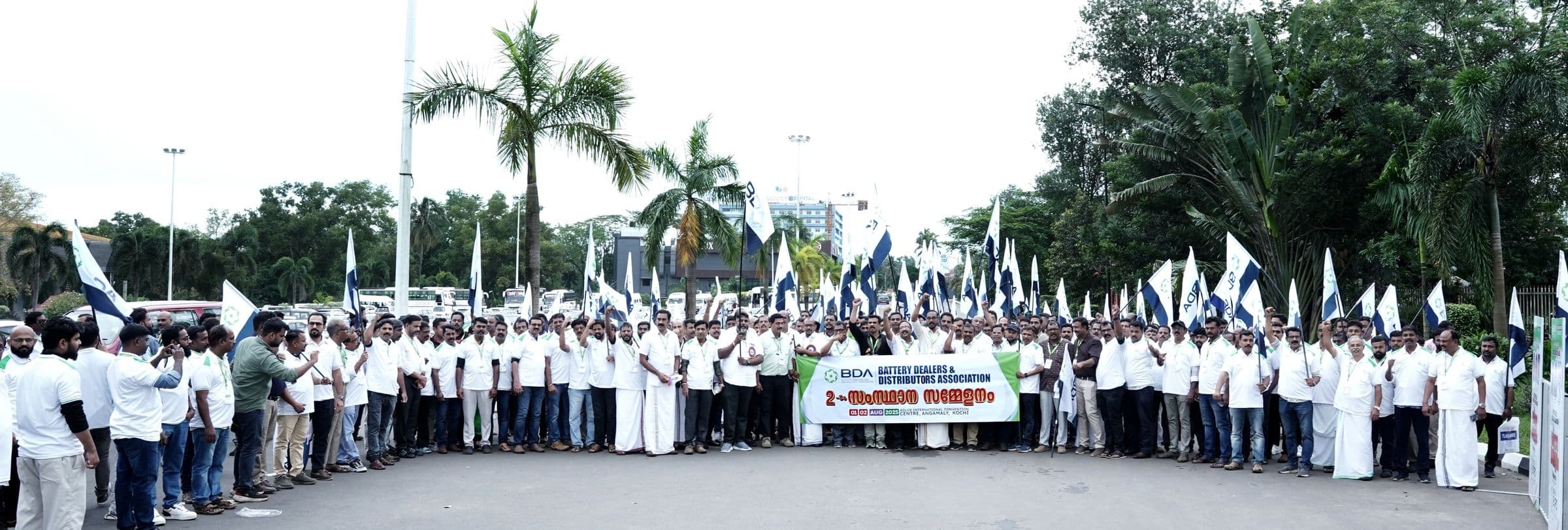 A promotional rally with flags gathered for an XES expo