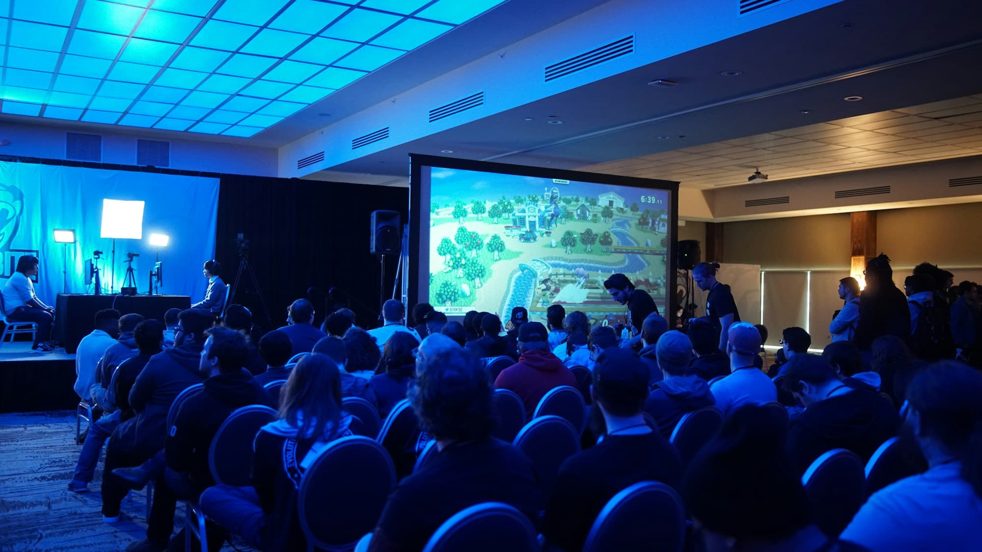 An attentive audience listens during a corporate conference session