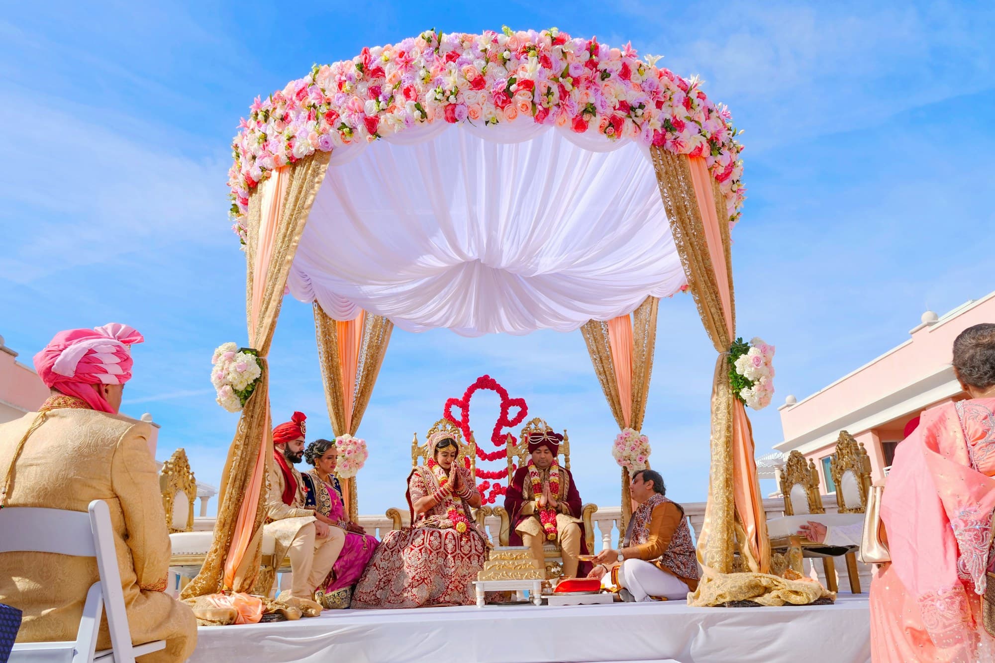 An ornately decorated mandap set for a traditional Indian wedding ceremony