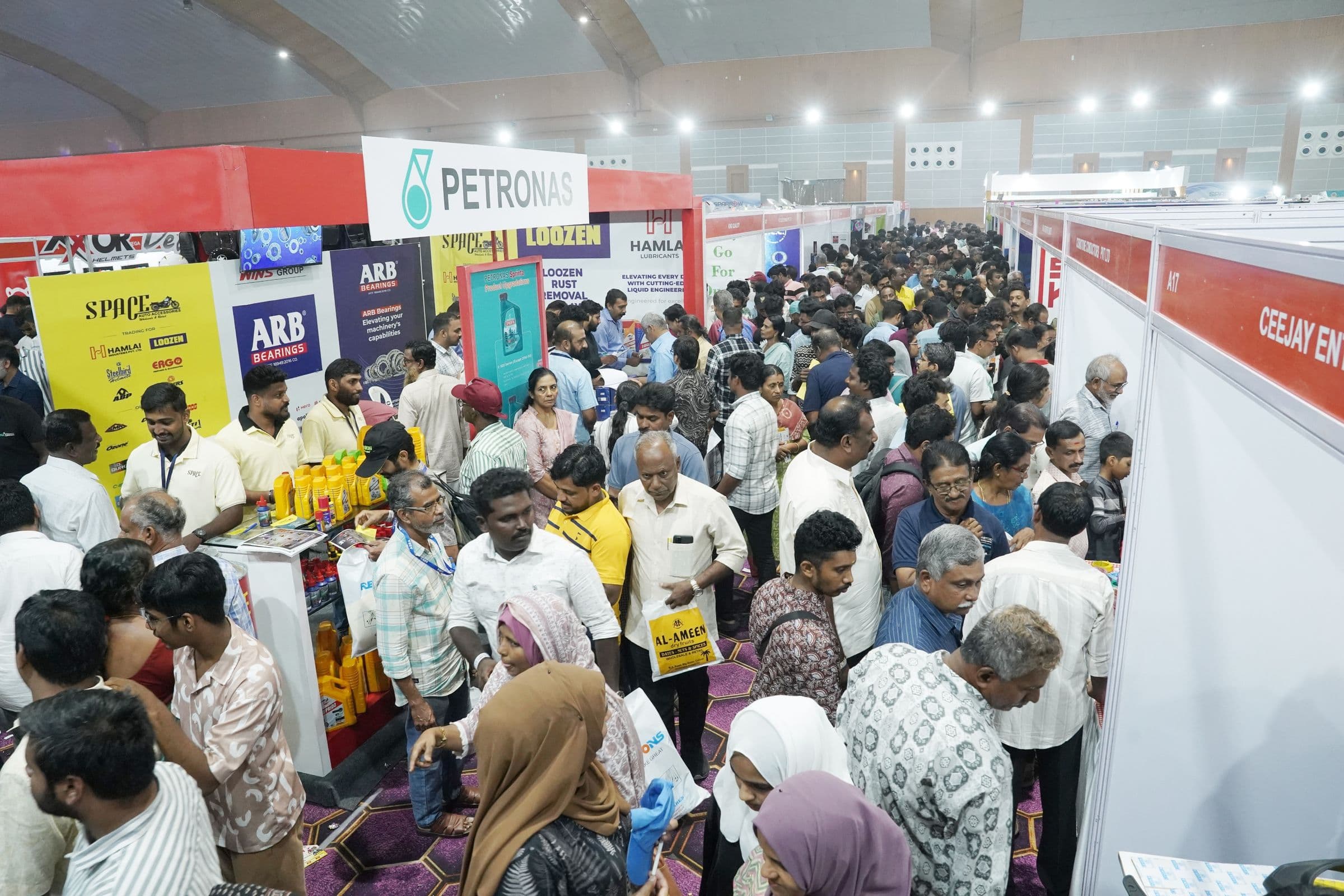 Busy exhibition aisles lined with branded stalls at Spare Expo